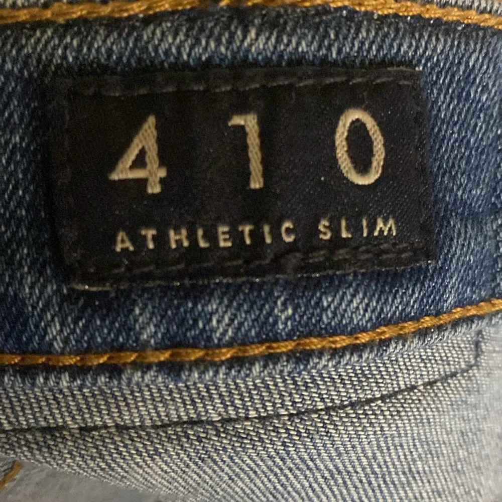 Lucky Brand 410 Athletic Slim jeans size 34x34 cuffs slit for boots